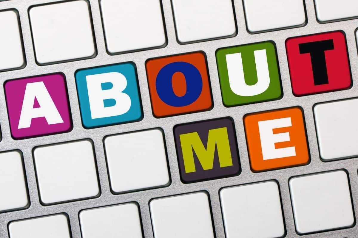 "ABOUT ME" in colorful letters on a laptop or computer keyboard