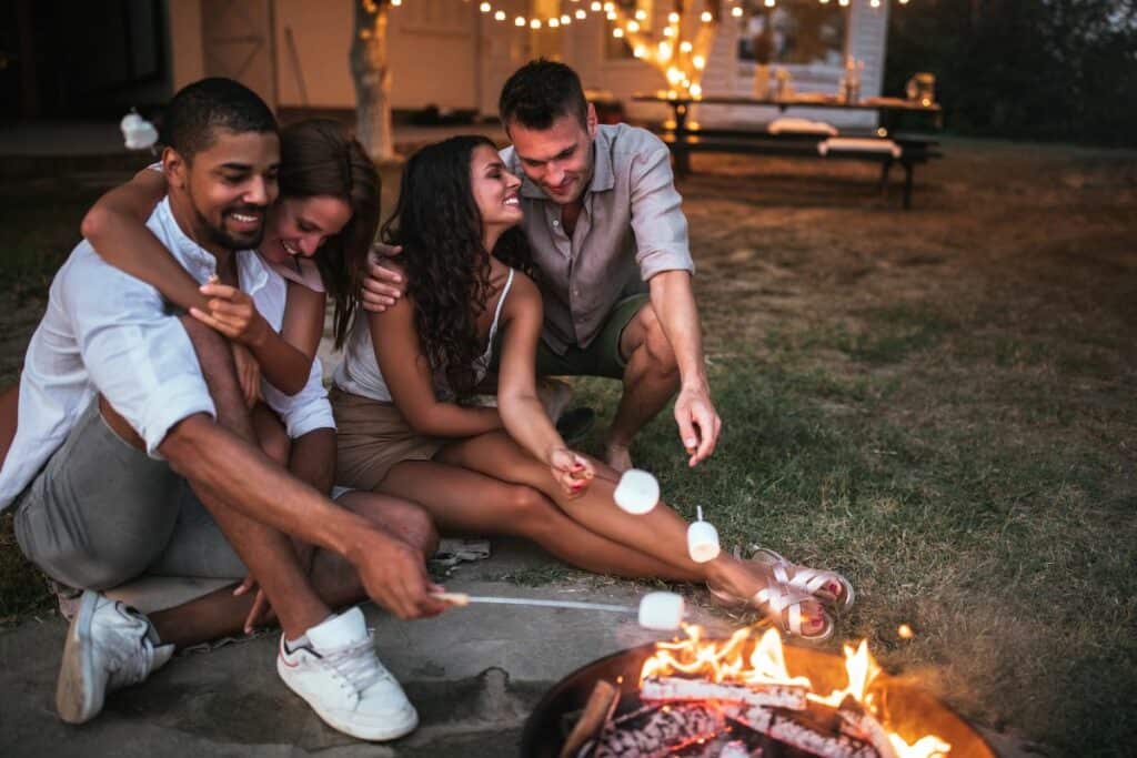 double date by the bonfire roasting marshmallows