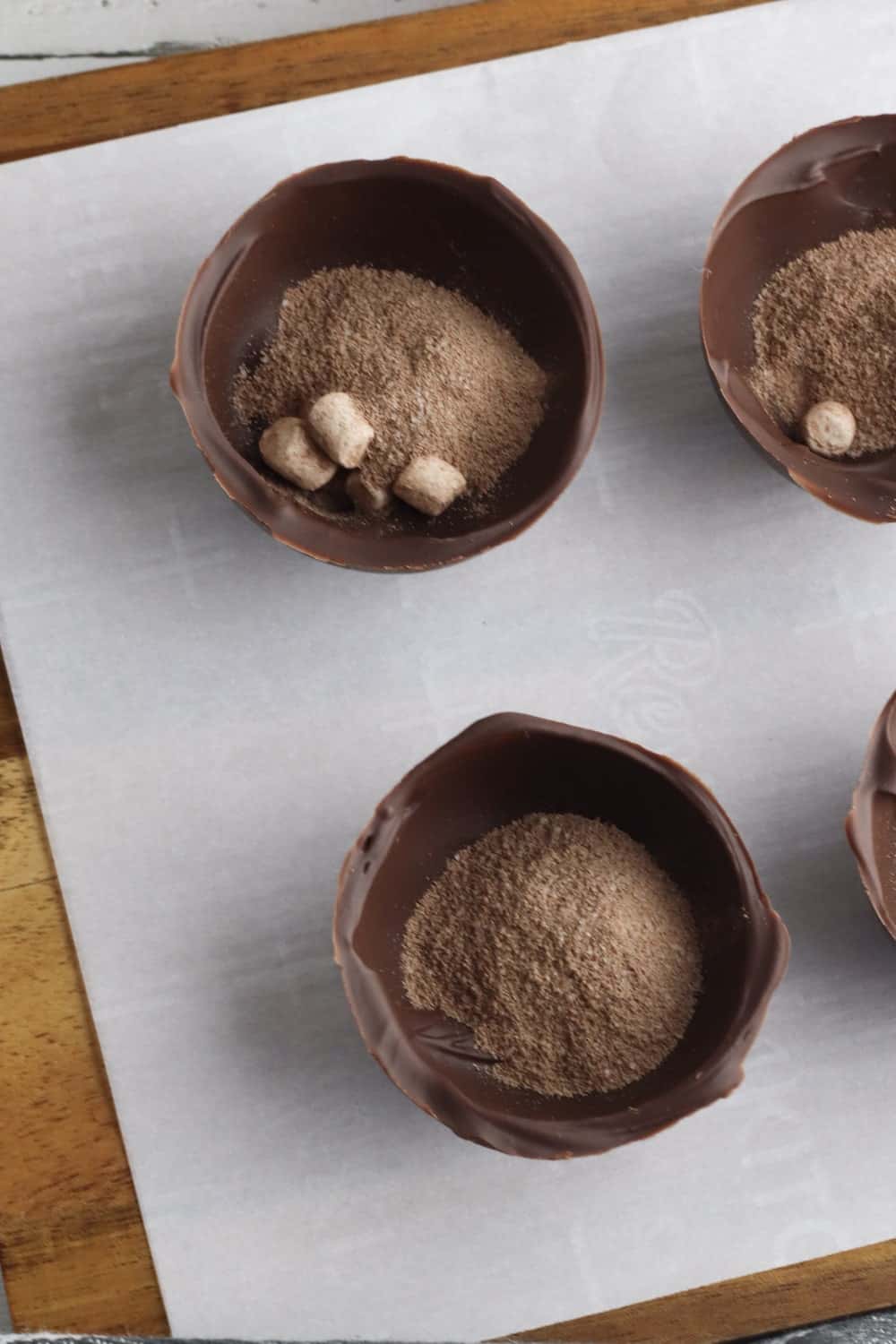 cocoa powder into the chocolate shell