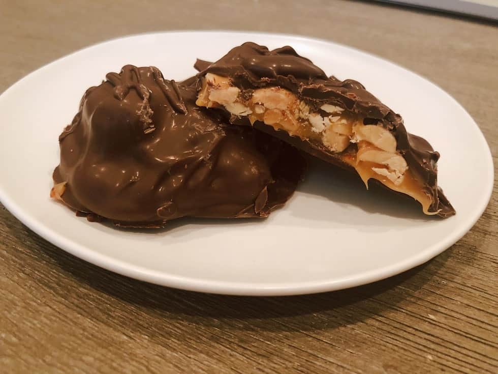 chocolate Peanut Caramel Cluster split into two