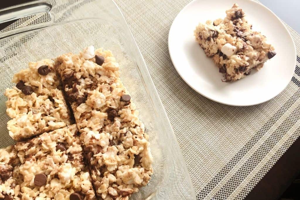 the dish of rice krispie treats and one on a plate