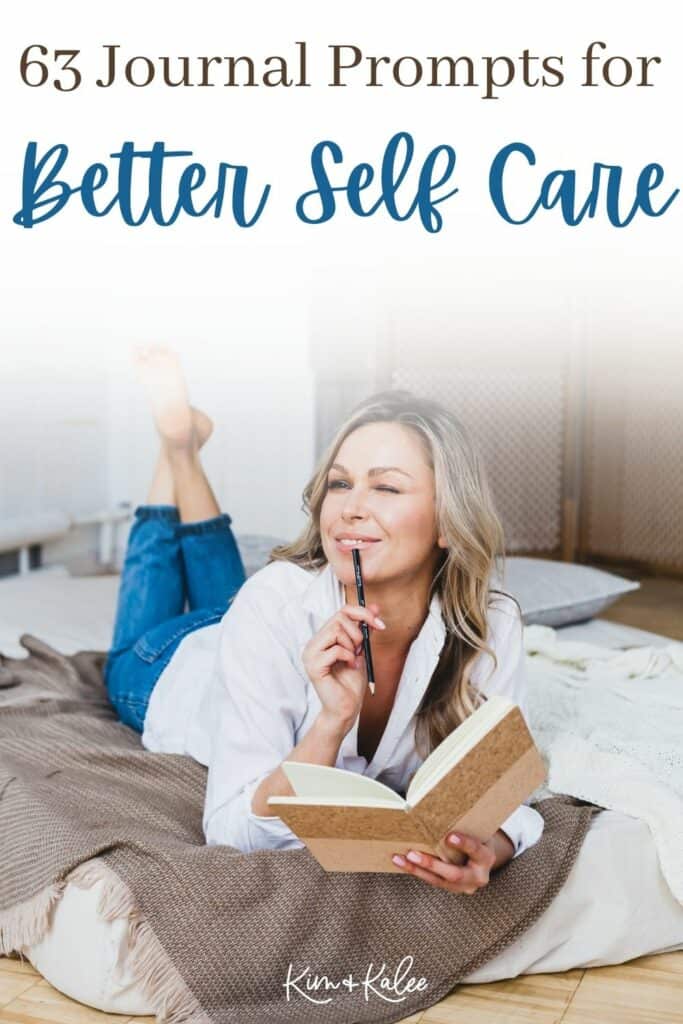 a woman journaling on her bed with her legs kicked up with the words "63 Journal Prompts for Better Self Care" written across the top