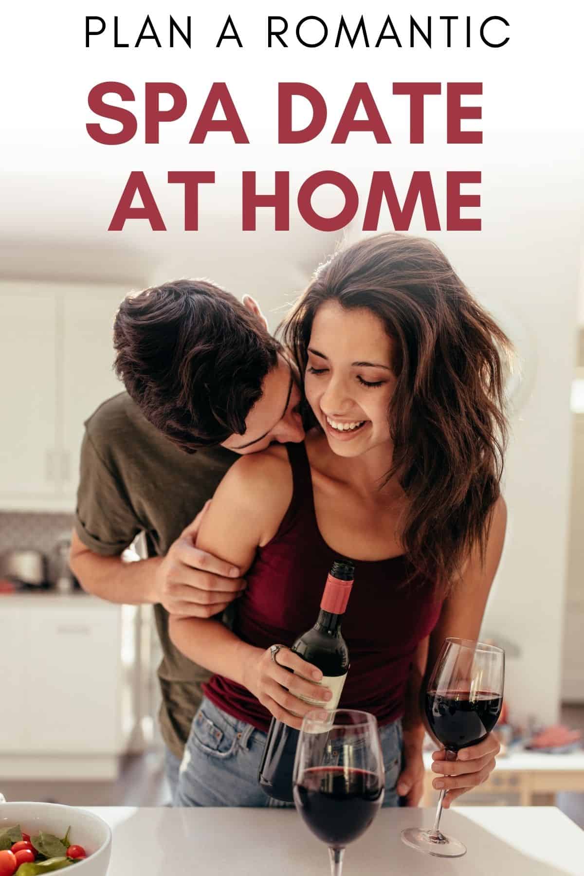 couple in the kitchen with 2 glasses of wine