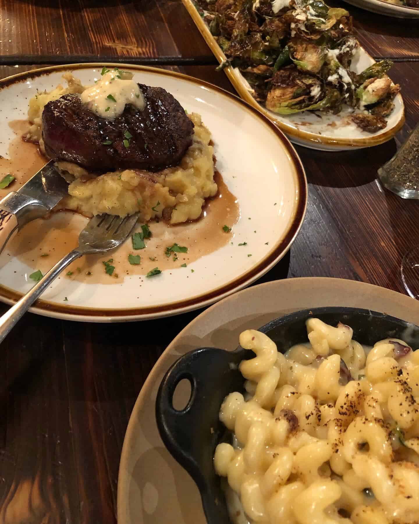 steak, mash potatoes and mac and cheese at Copper