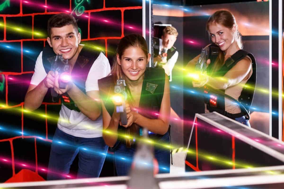 group of people playing laser tag