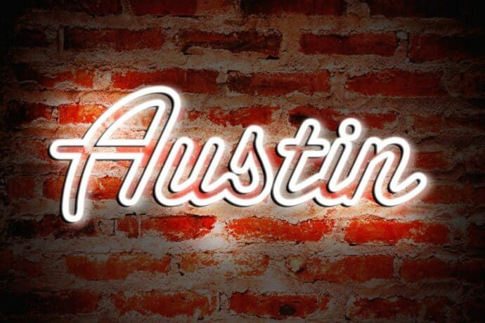 Austin TX written in neon white letters