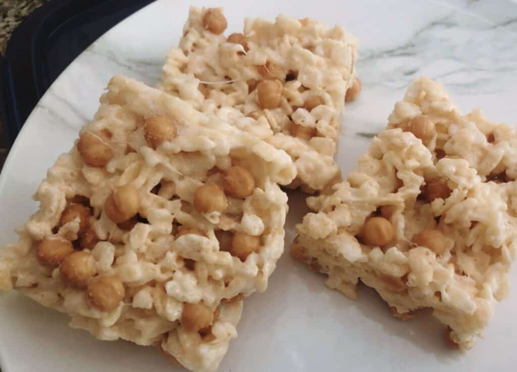 3 salted caramel rice krispie treats on a plate