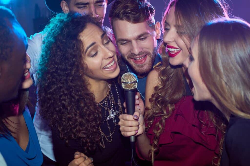 group of friends singing karaoke