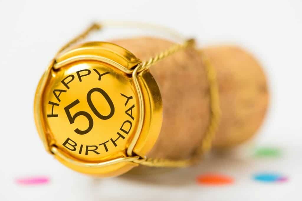 cork with "happy 50 birthday" on it