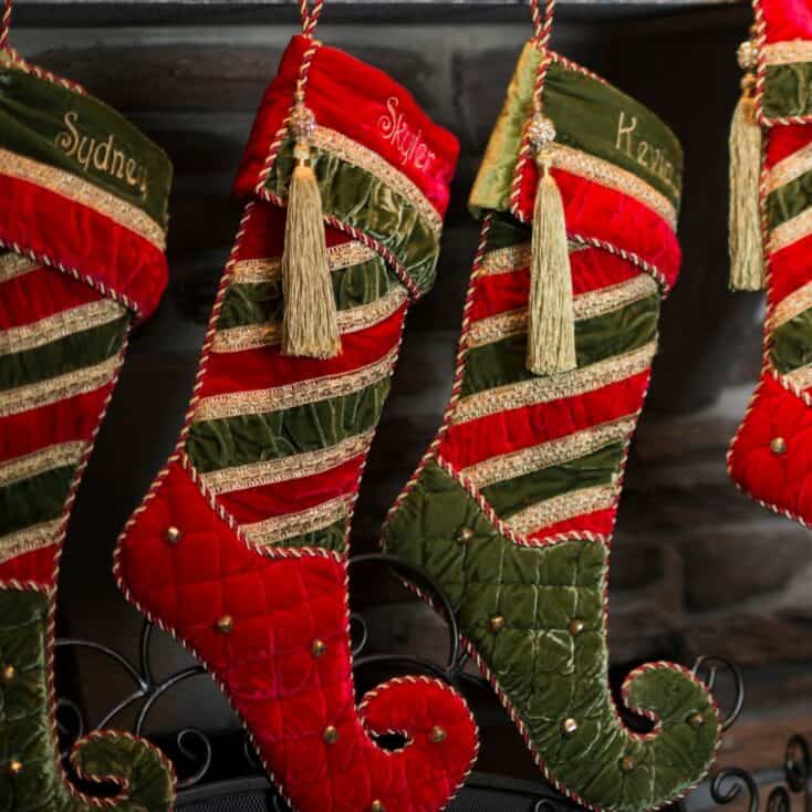 close up of 4 Christmas stockings on a mantle