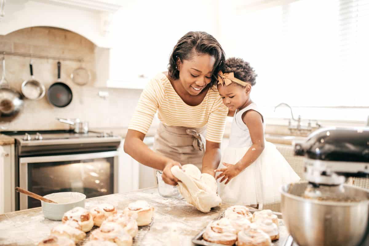 mother and young daughter baking