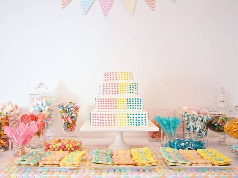 candy table with a birthday cake on it