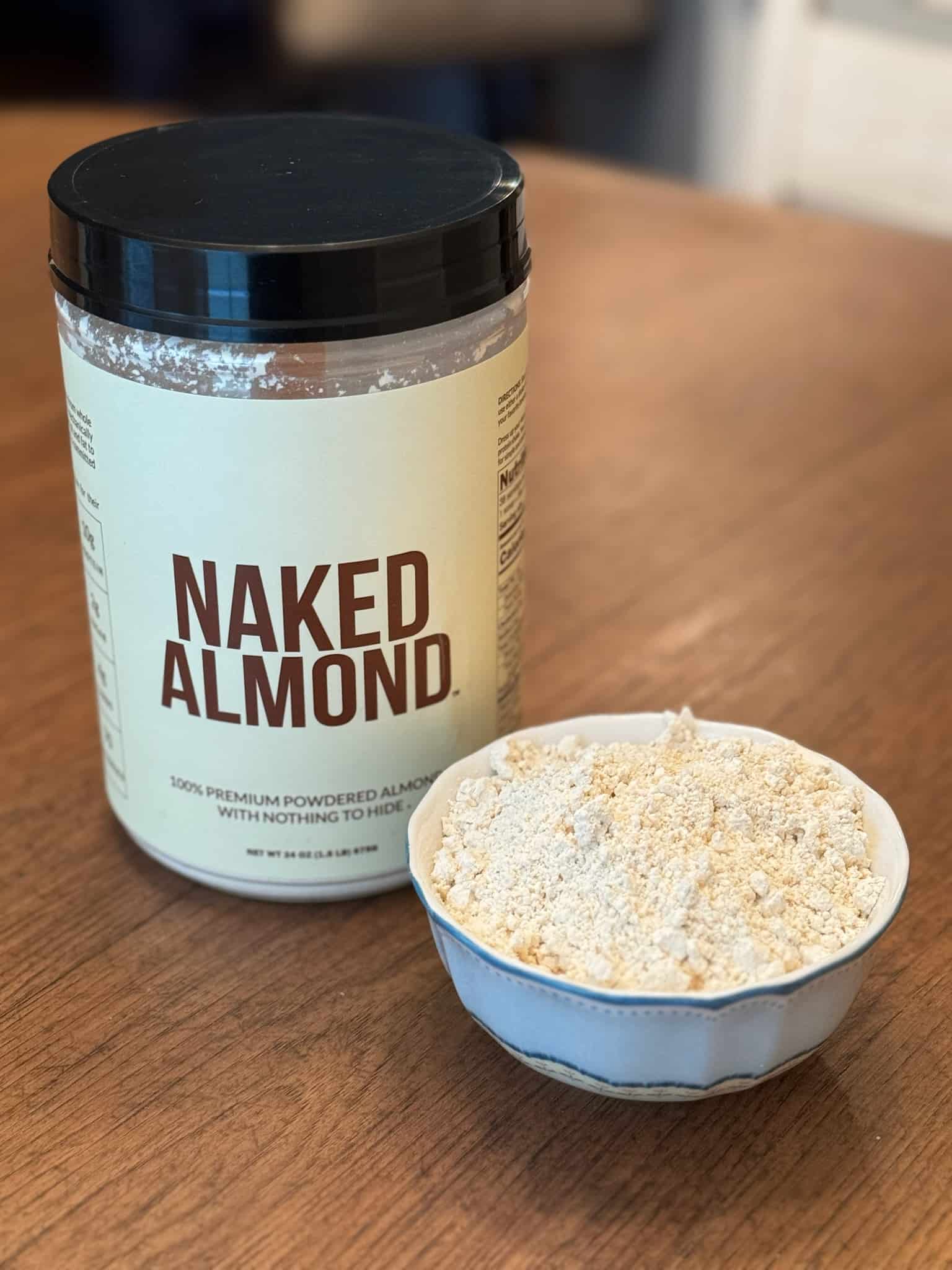 naked almond powder container and in a small bowl