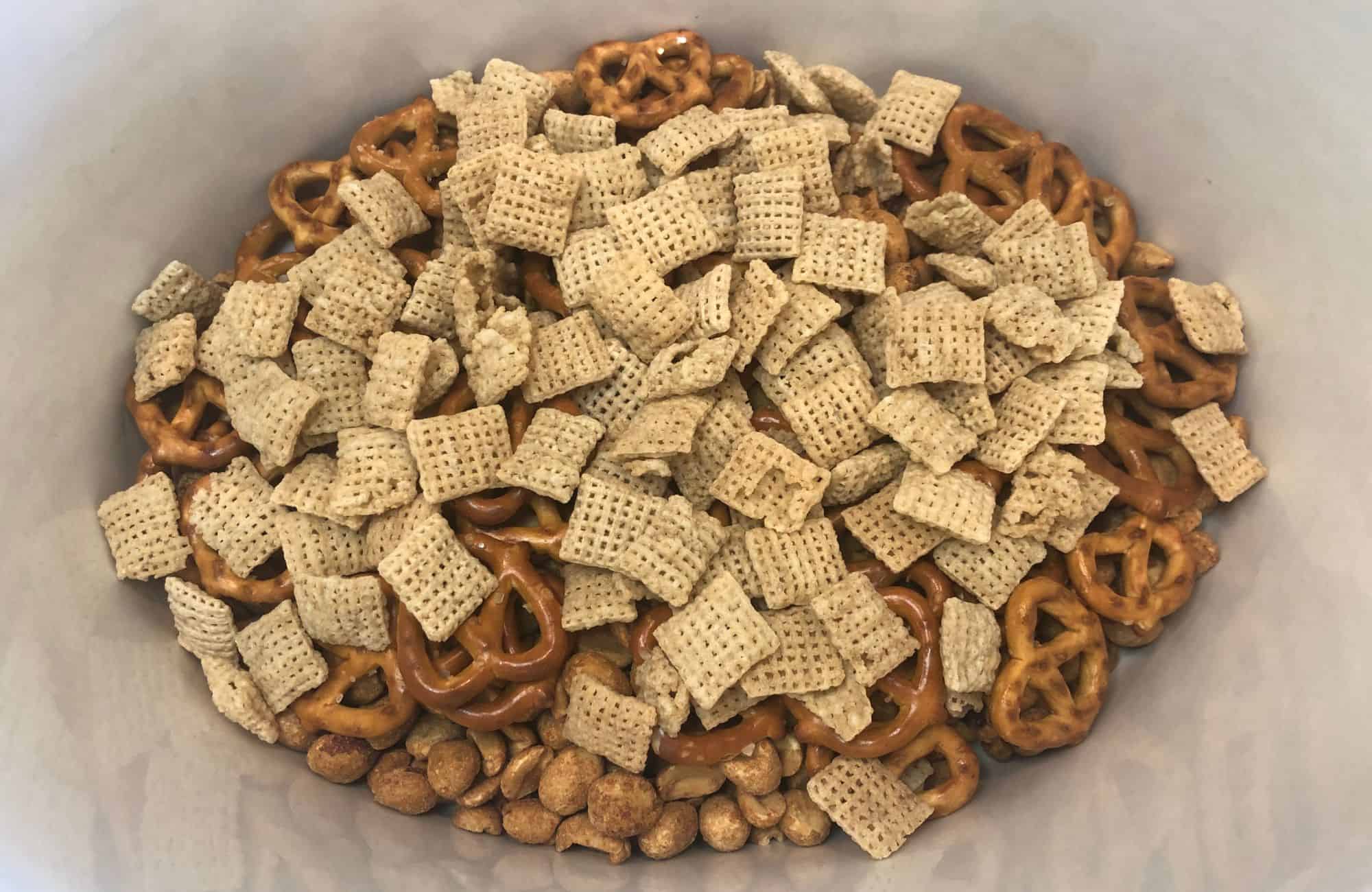 chex mix pretzels and peanuts in the crockpot