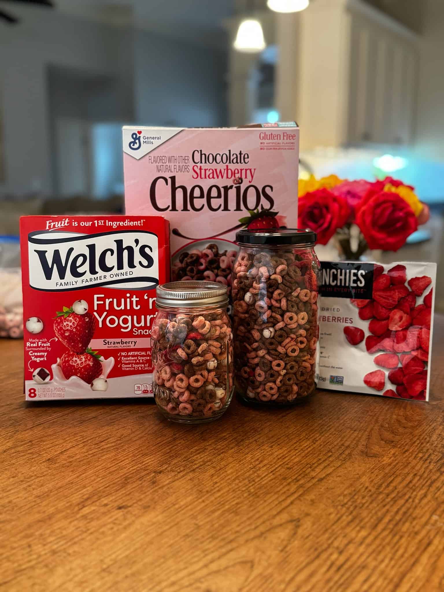 Strawberry Valentine Mix Ingredients and finished snack mix in mason jars