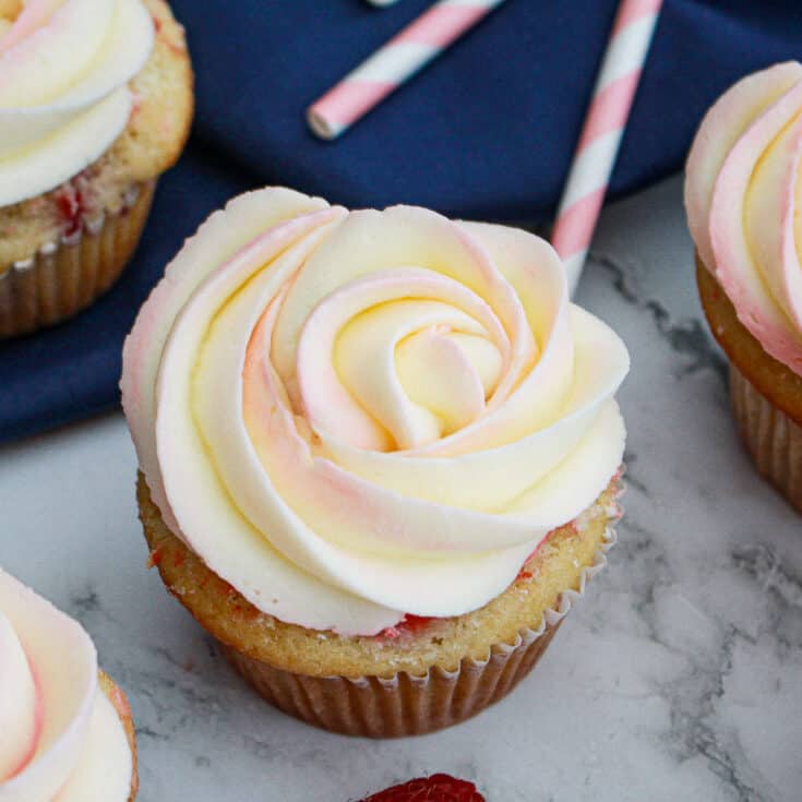 multiple raspberry white chocolate buttercream cupcakes