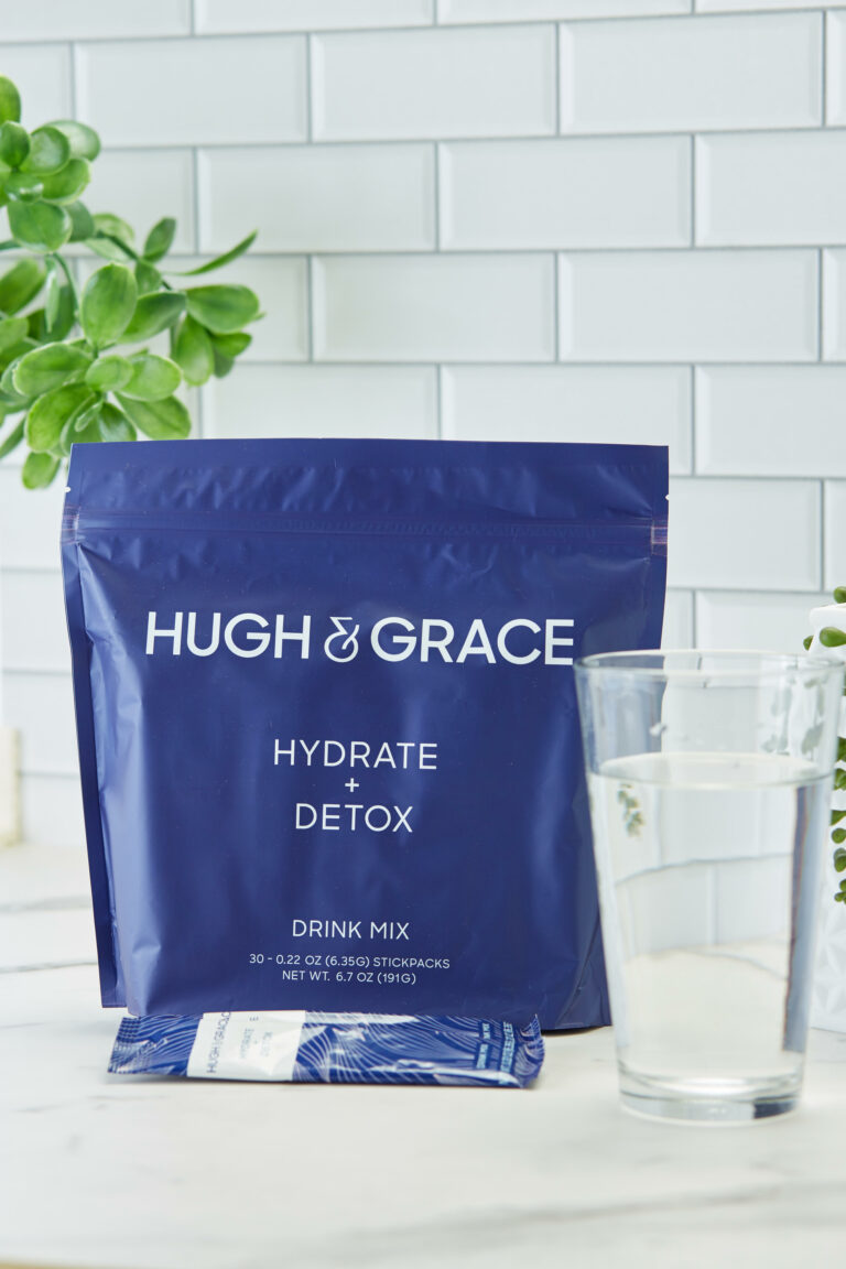 Hugh Grace Hydrate Detox bag, packet, and in a glass of water