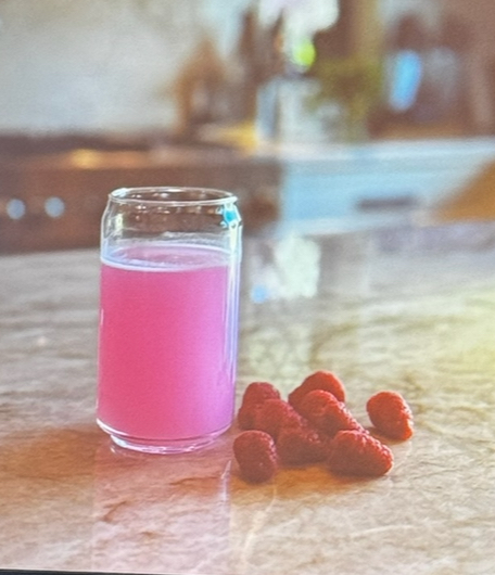 Hugh and Grace Raspberry Ice Clear Protein in a glass