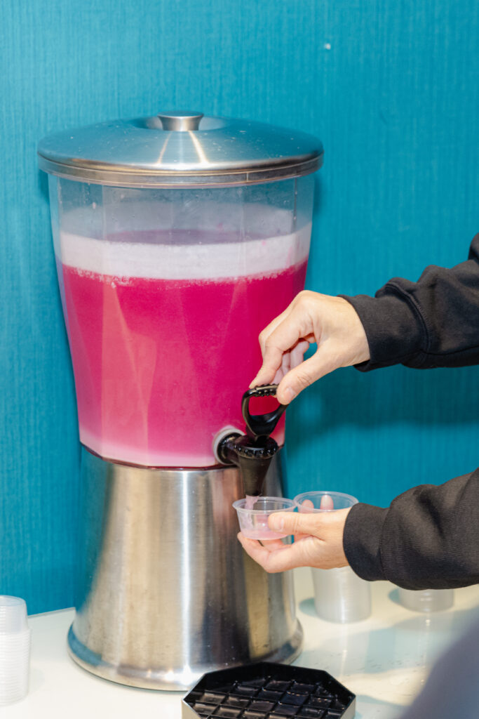 Hugh and Grace Raspberry Ice Clear Protein in a large container